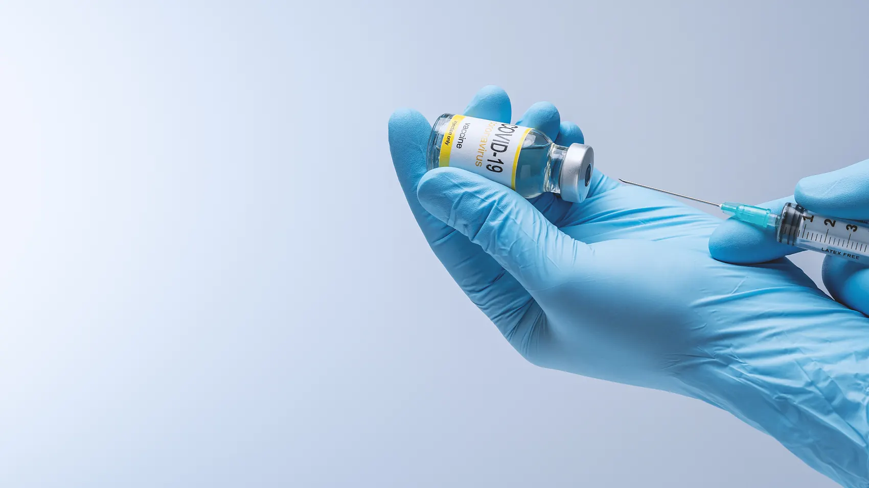 Researcher holding a sample vial